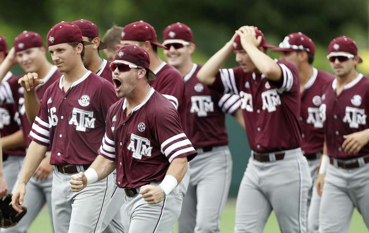 Texas A&M players celebrate after pulling out a 4-3 win over the Houston Cougars to win an NCAA regional baseball series at Schroeder Park, in Houston on June, 5, 2017.