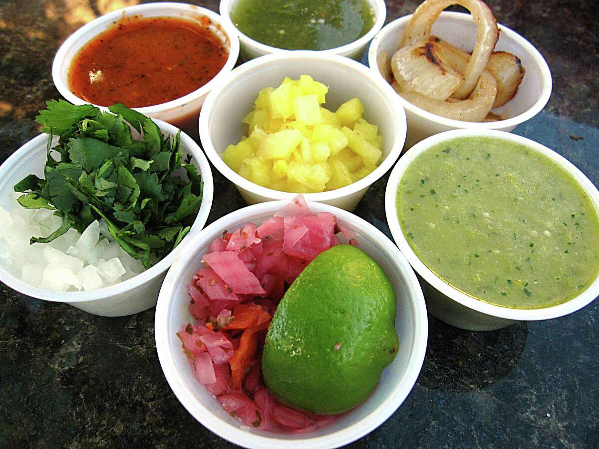 Pickled onions, cilantro, pineapple, salsas and more from the salsa bar at El Taco Grill.