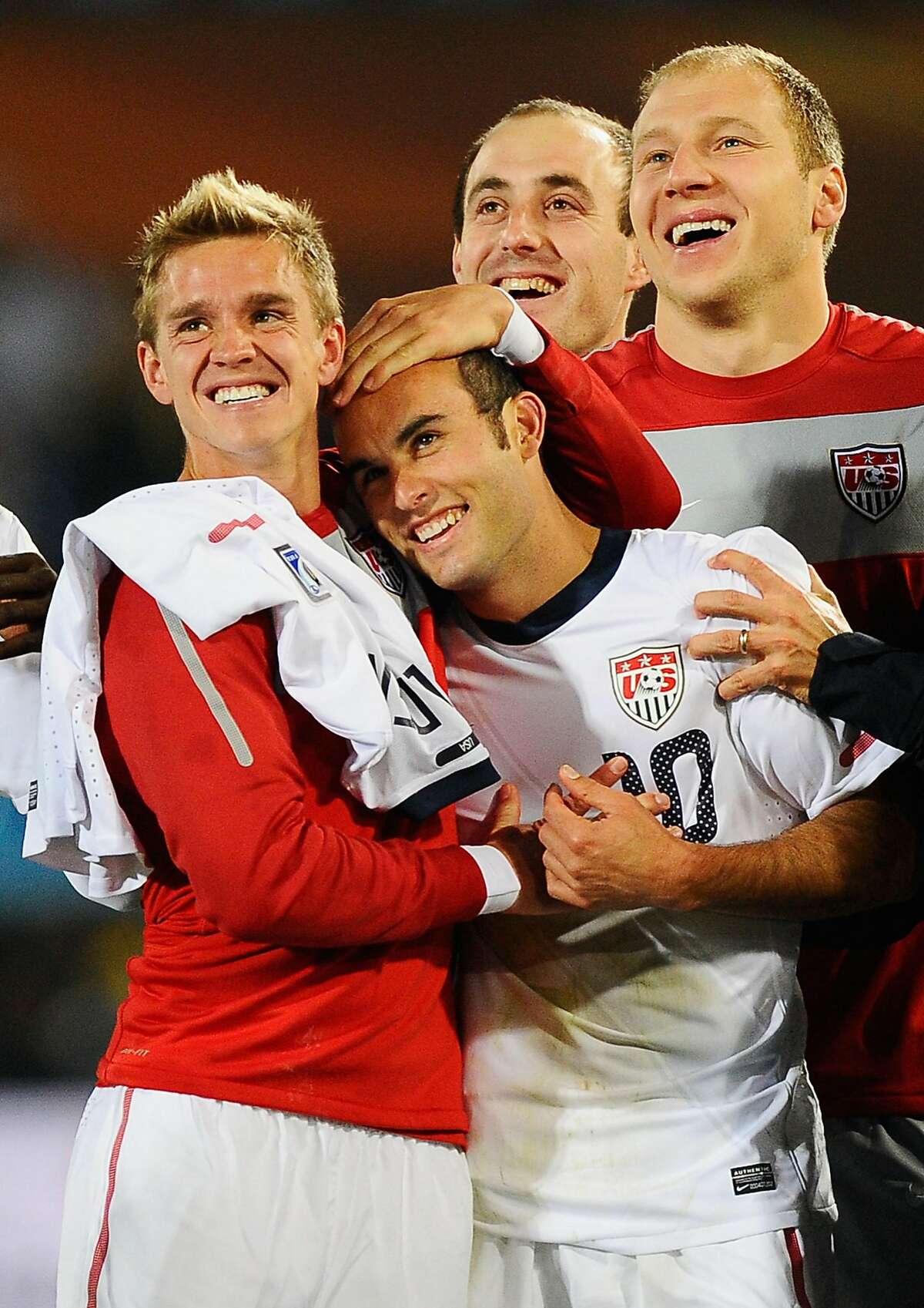 PRETORIA, SOUTH AFRICA - JUNE 23: Stuart Holden and Landon Donovan of the United States celebrate with team mates the victory that sends the USA through to the second round in the 2010 FIFA World Cup South Africa Group C match between USA and Algeria at the Loftus Versfeld Stadium on June 23, 2010 in Tshwane/Pretoria, South Africa. (Photo by Kevork Djansezian/Getty Images) *** Local Caption *** Stuart Holden;Landon Donovan