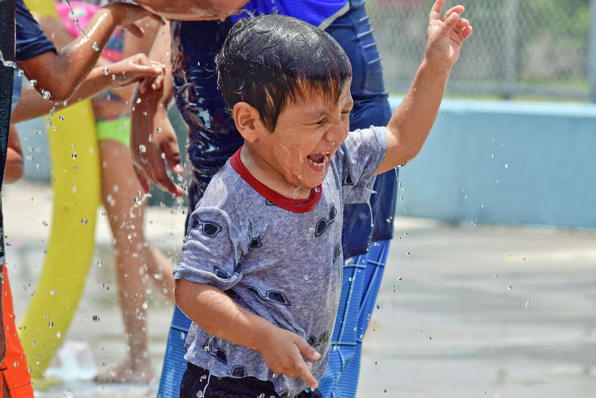 Two year old Luis Rodriguez reacts as water splashes in his face at the Dr. Cecilia May Moreno Splash Park Wednesday, June 07, 2017.