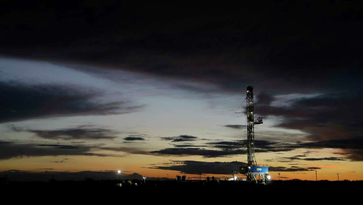 A drilling rig is seen at sun set after thunderstorm passed through the area, Monday, June 5, 2017, near Karnes City, Texas. (AP Photo/Eric Gay)