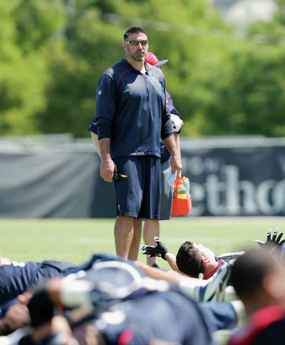 The intense Mike Vrabel takes over as defensive coordinator, a change he's enjoyed during OTAs.