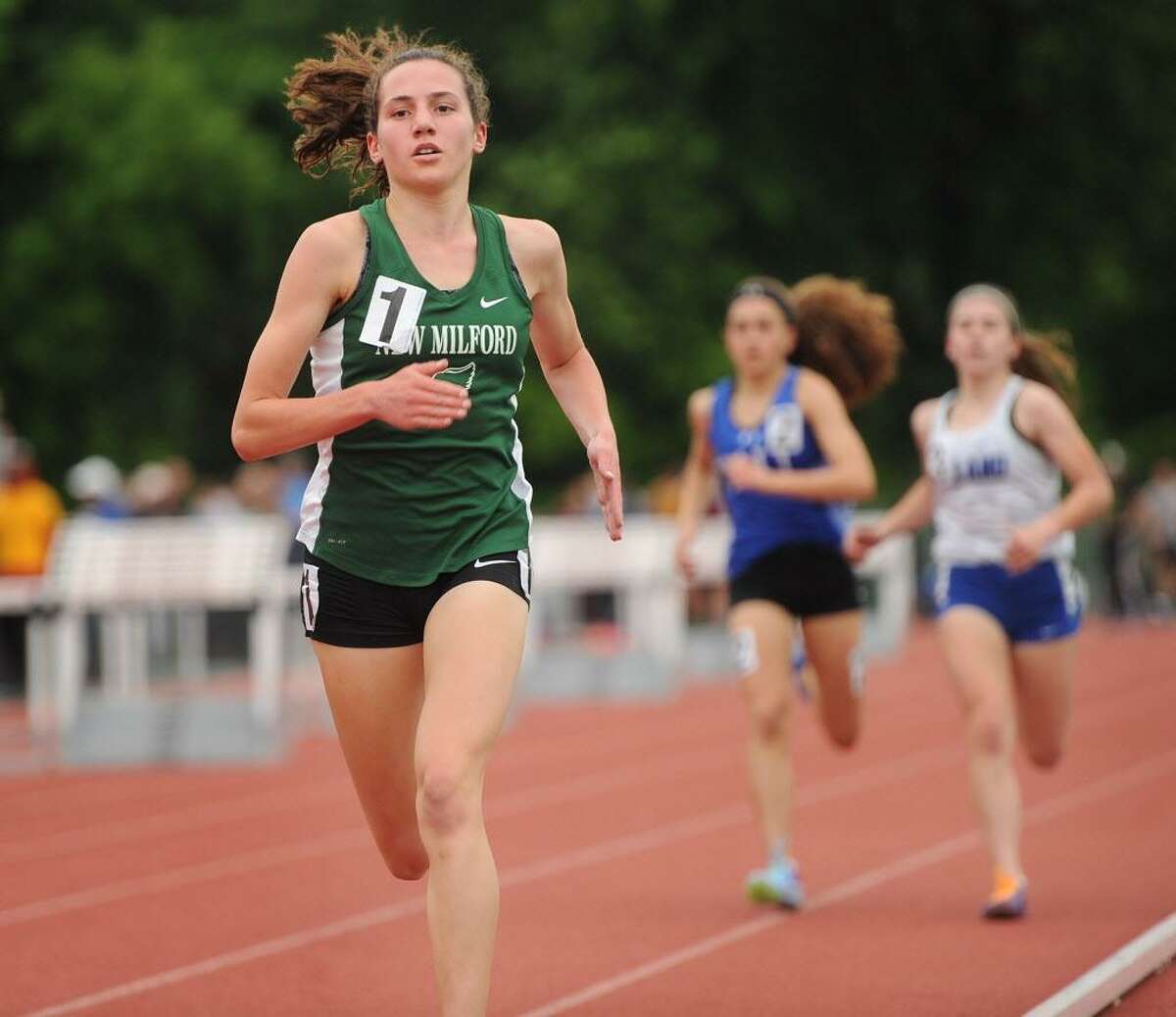 New Milford's Mia Nahom runs to an easy victory in the girls 1600 meters at the State Open outdoor track championships at Willow Brook Park in New Britain on Monday.