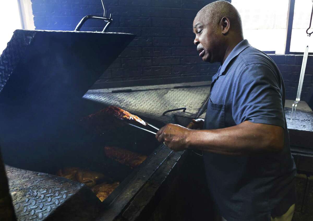 Jerry Miller, owner and pitmaster at CB's Bar-B-Que in Kingsville, TX, checks a brisket being smoked at the restaurant he has had for 20 years. He didn't know much about Reality Leigh Winner, the NSA leak suspect who grew up in Kingsville, Tx, on Wednesday, June 7, 2017.