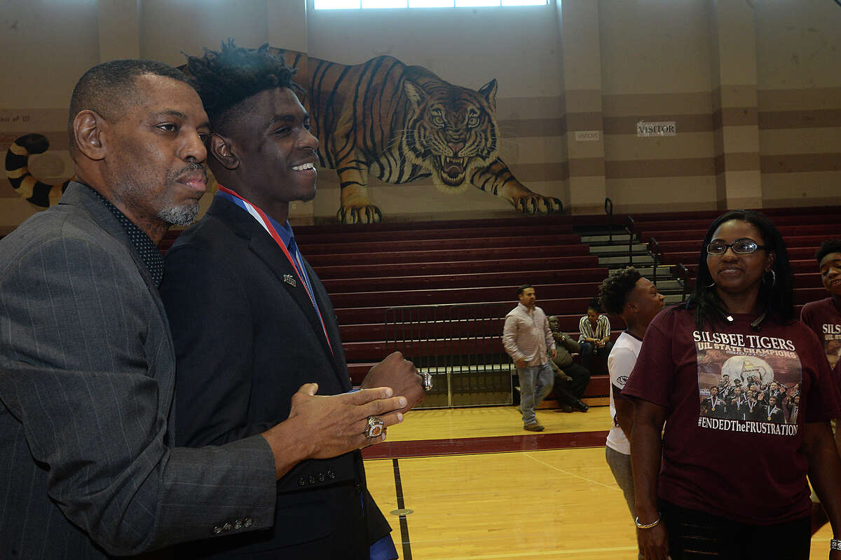 Silsbee's assistant coach Ira Brooks and Kalon Barnes get together to pose for a photo during a ring ceremony honoring the 2017 state basketball champions and presenting them with their championship rings at the high school Wednesday. Photo taken Wednesday, June 7, 2017 Kim Brent/The Enterprise