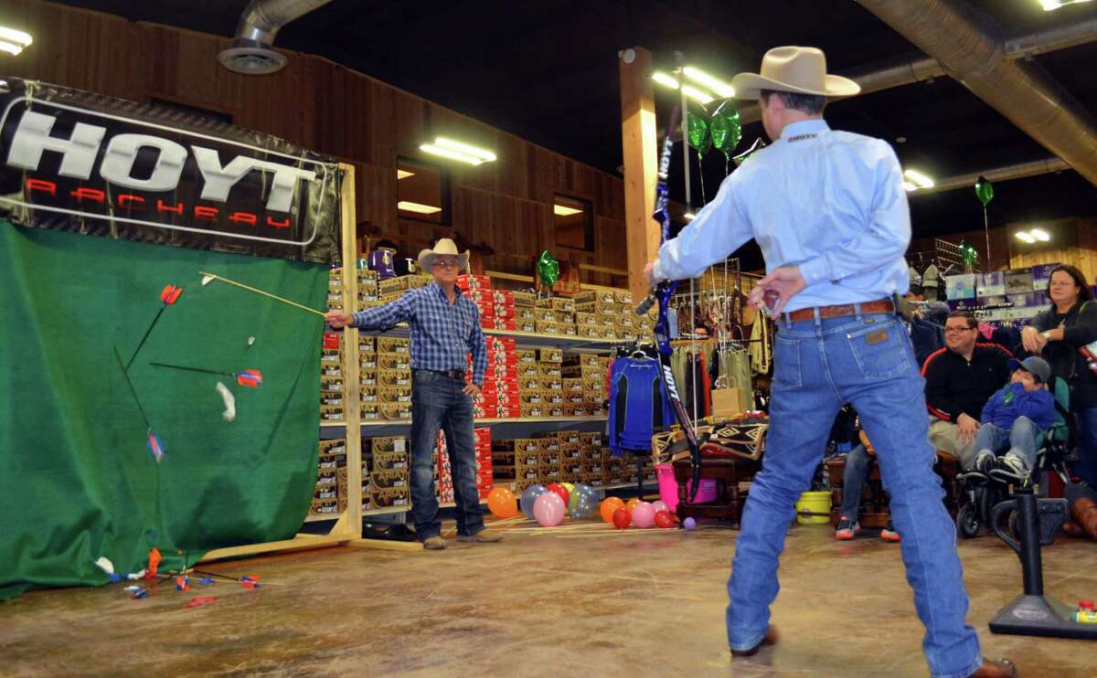 Professional archer Frank Addington, who will headline the third annual Texas Hill Country Shooting Classic & Sporting Expo at Joshua Creek Ranch on June 10, fires arrows from behind his back during one of his entertaining exhibitions in Boerne.