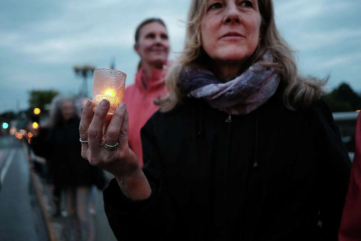 Westporters attend a vigil and rally June 4 on the Post Road Bridge in support of the environment.
