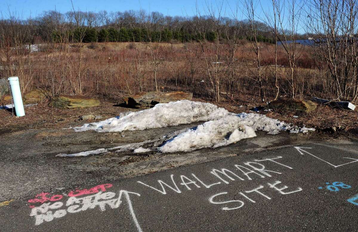 The site where a new Walmart will be built off of Victoria Drive is noted in spray paint on the pavement in Monroe, Conn., on Thursday Feb. 18, 2016. The big box retailer could break ground on the store this summer.