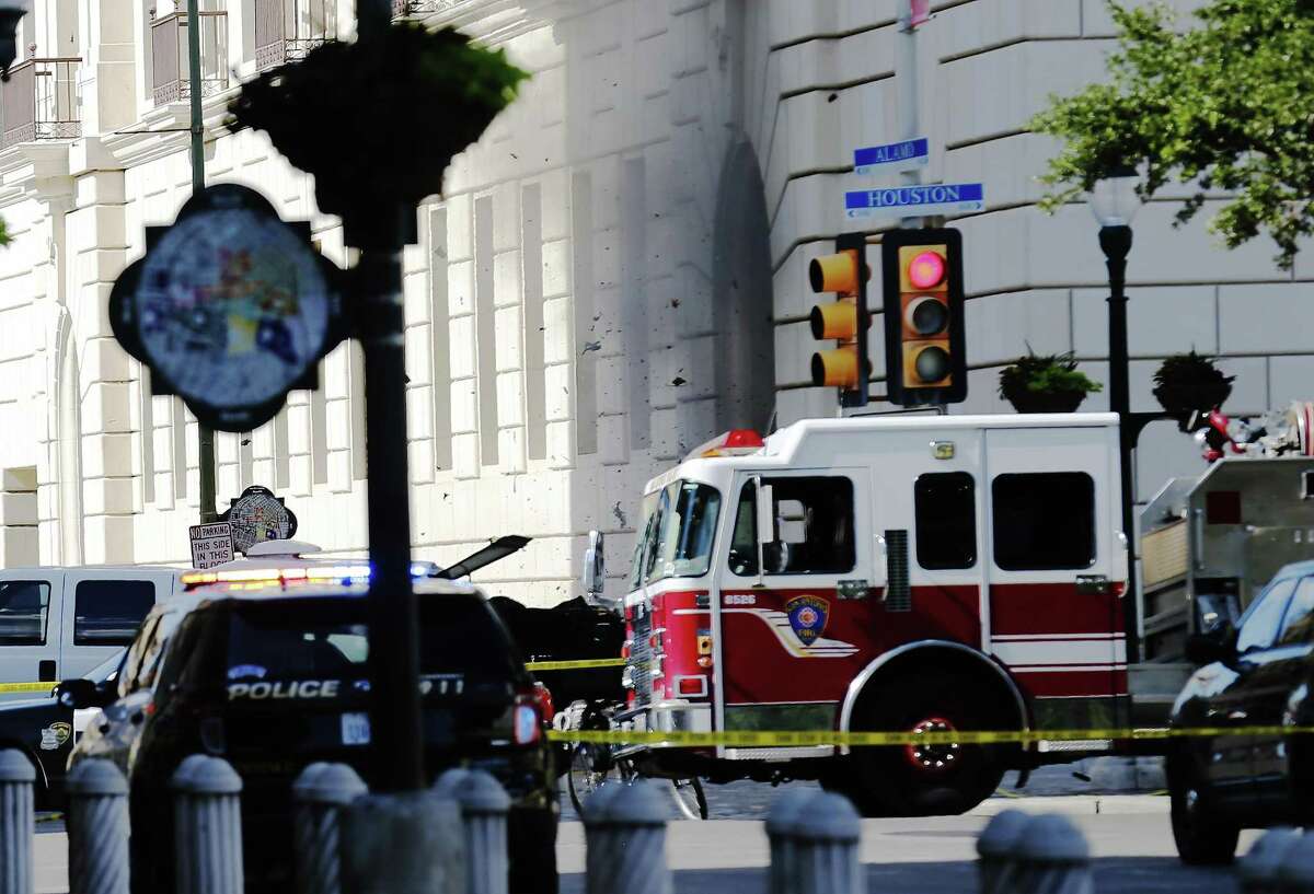 Debris flies skyward as bomb experts detonated a suspicious package after three men were arrested at the Hipolito Garcia Federal Building and United States Courthouse in downtown on Wednesday, June 7, 2017. Streets were blocked off by law enforcement as they determined the nature of the package. After about an hour after the arrests were made, a loud explosion echoed throughout the Alamo Plaza as the suspicious item was detonated. FBI investigators as well as other federal law enforcement officials were on the scene to further investigate the incident. No one was harmed or injured at the scene. (Kin Man Hui/San Antonio Express-News)
