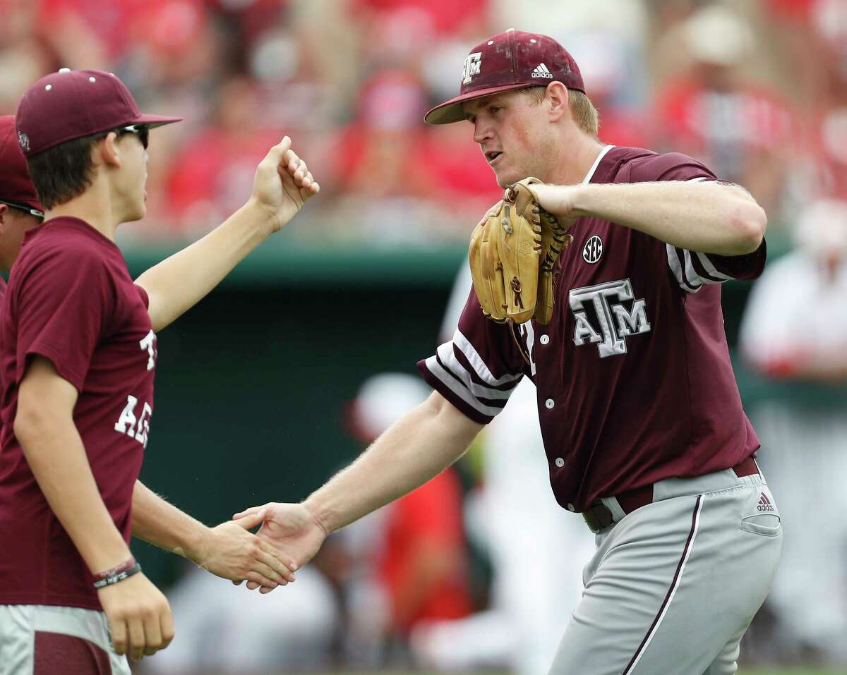 Texas A&M pitcher Stephen Kolek (32) celebrates after getting out of the eighth inning during Game 6 of an NCAA Regional baseball game at Schroeder Park, in Houston, Monday, June, 5, 2017. ( Karen Warren / Houston Chronicle )