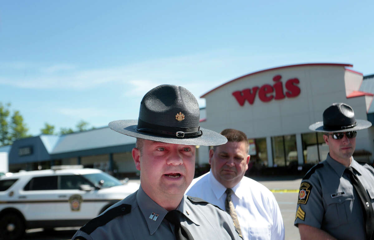 Pennsylvania State Police Troop P Commanding Officer Jonathan Nederostek gives a statement to the press as the State Police investigate the murder of three people and the suicide of the shooter 24-year-old Randy Robert Stair, of Dallas, Pa., at the Weis Supermarket on the Hunter Highway in Eaton Township, Pa., on Thursday, June 8, 2017. Stair barricaded entrances and exits, one person was able to escape. (Jake Danna Stevens/ The Times-Tribune, Via AP)