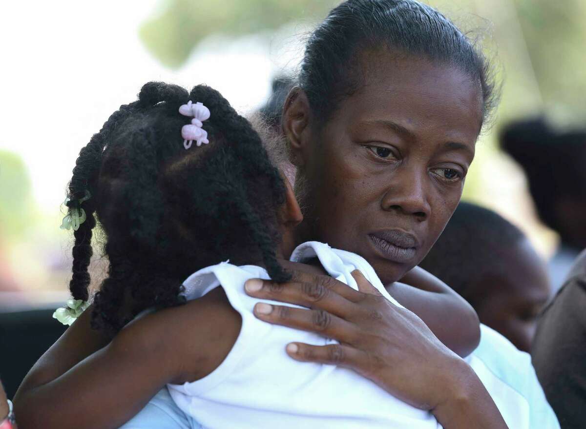 Shirley Davidson, mother of Gerean Brown, holding Brown's daughter while waiting for more information from the police after hearing that the police had found a body just after they started searching for Brown one block away Thursday, June 8, 2017, in Houston. Clothing on the body found at 3900 block of Eastex Freeway matched description of the missing man. Brown, 26, went missing after he left Mr. A's club 10 days ago. ( Yi-Chin Lee / Houston Chronicle )