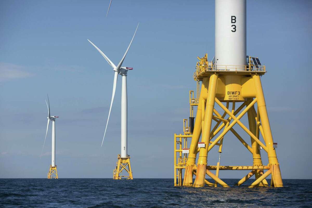 FILE - In this Monday, Aug. 15, 2016 file photo three of Deepwater Wind's turbines stand in the water off Block Island, R.I. Maryland regulators on Thursday, May 11, 2017, approved plans for the nations first large-scale offshore wind projects. The Maryland Public Service Commission awarded renewable energy credits for two projects off Marylands Eastern Shore near Ocean City. Those projects significantly outrank by size the nations sole offshore wind farm known as Block Island off Rhode Island. (AP Photo/Michael Dwyer, File)