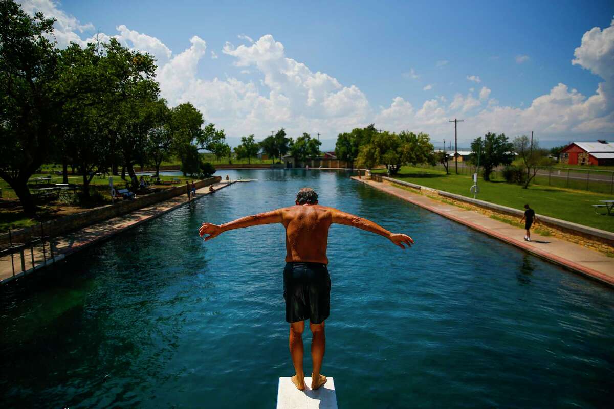 Doug Witkowski, from Dripping Springs, prepares to dive into the crystal clear waters of the worlds largest spring-fed swimming pool at Balmorhea State Park Friday, Sept. 16, 2016 four miles west of Balmorhea in Toyahvale, TX.
