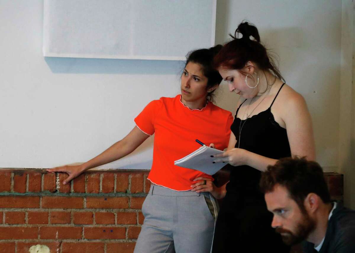 Choreographer Laura Gutierrez talks to assistant director is Isabella Eleuterius as director Matt Hune watches dancers rehearse a new dance adaptation set to StravinskyÂ?’s "The Rite of Spring," at the Rec Room downtown, Wednesday, May 31, 2017. ( Karen Warren / Houston Chronicle )