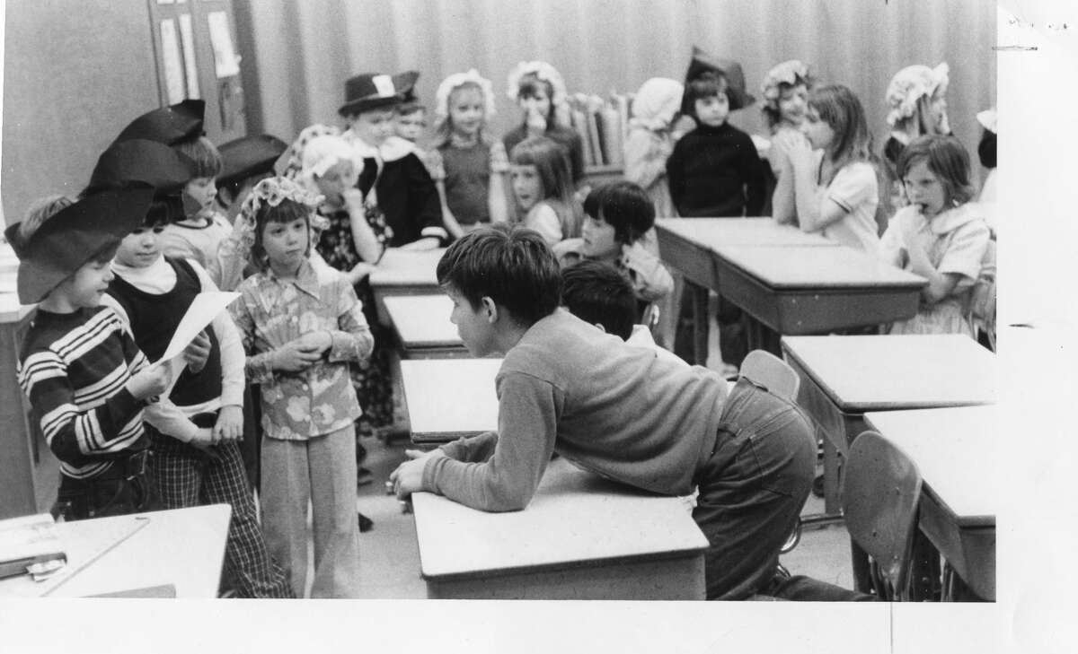 Patrick Biel reads the treaty to the British, which seems to interest Steve Behmlander, right. Chippewassee Elementary. April 1976