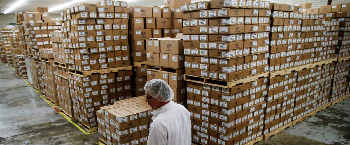 Atkinson Candy Company president Eric Atkinson walks through a storage room at the company Wednesday, May 17, 2017 in Lufkin. ( Michael Ciaglo / Houston Chronicle )