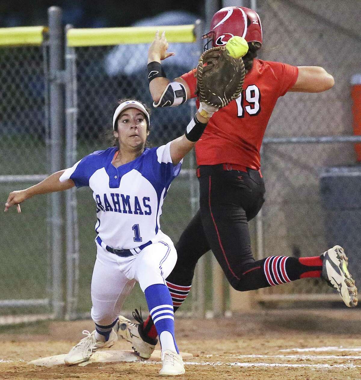 Brooke Vestal beats the throw to first as the Brahmas Kiersten Licea can't reach out far enough to make the out as Canyon plays MacArthur in clas 6A second round softball playoffs on May 5, 2017.