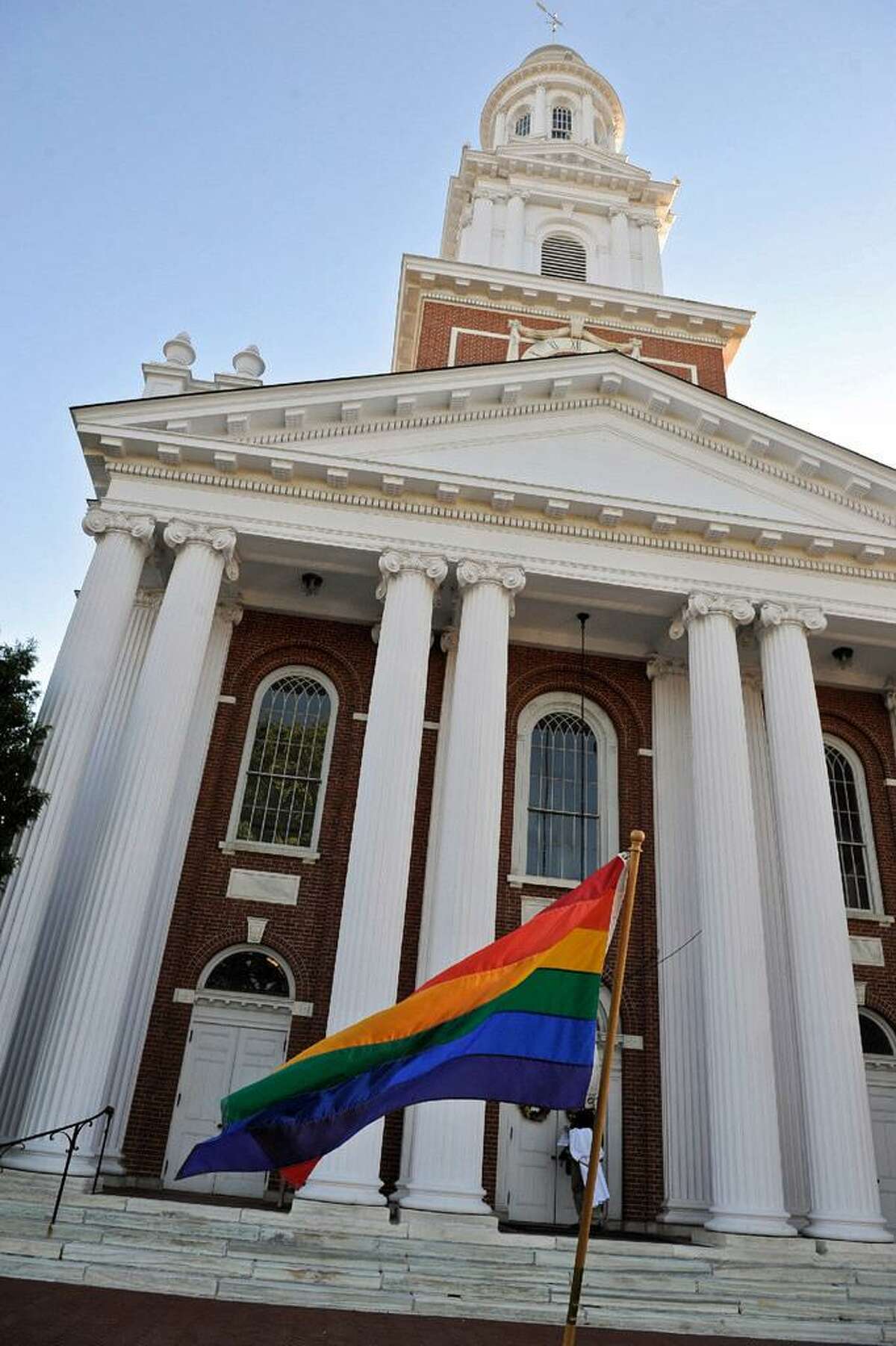 A rainbow flag flies in front of the First Congregational Church of Danbury during a 2016 vigil to honor those killed in the nightclub shooting in Orlando, Fl.