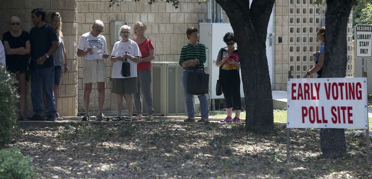 People line up to vote Tuesday May 30, 2017, at the Brook Hollow Branch Public Library. Voters have a chance to cast ballots for mayoral and City Council runoff races until 7 p.m. today. 