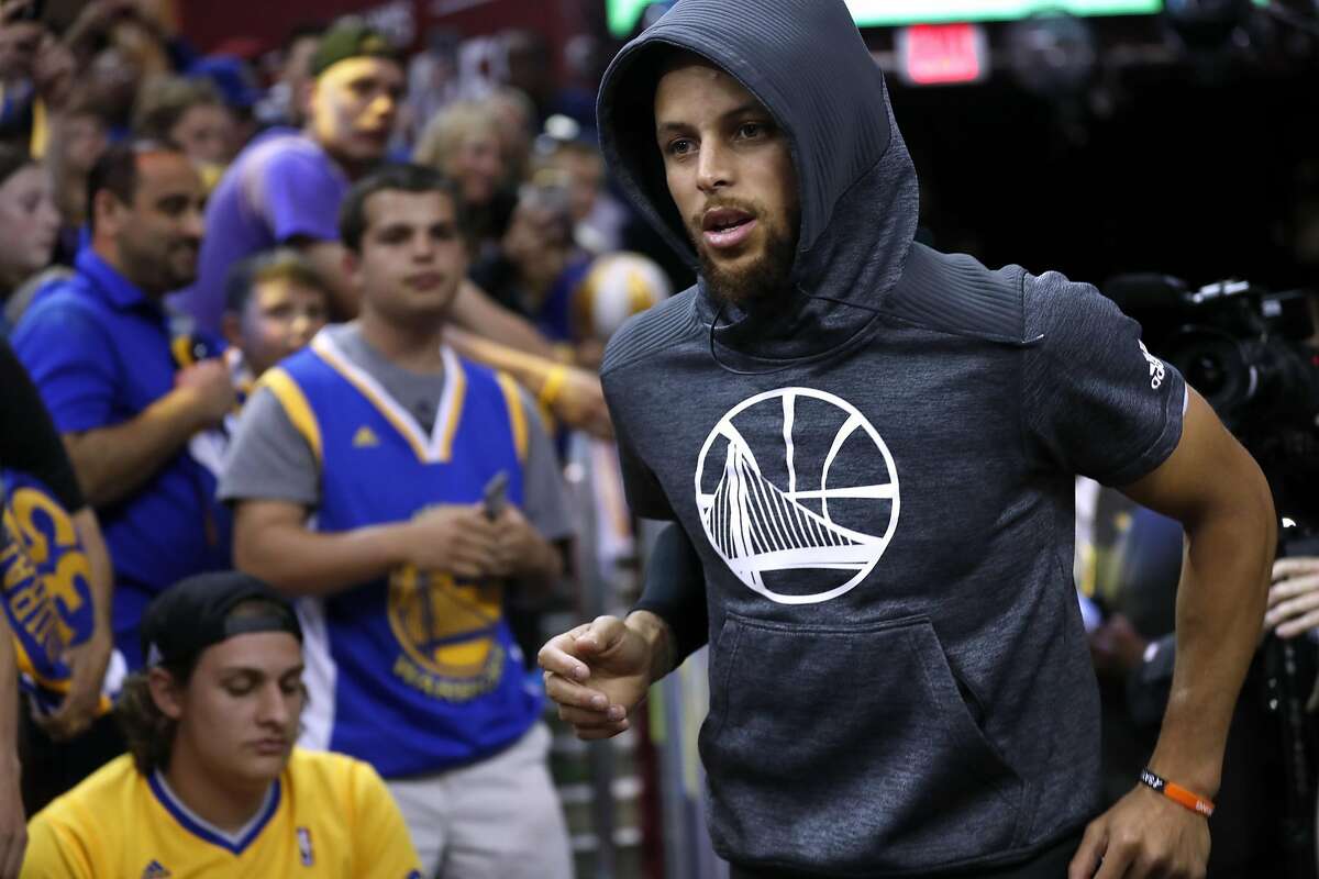 Golden State Warriors' Stephen Curry heads out to warm up before playing Cleveland Cavaliers in Game 4 of NBA Finals at Quicken Loans Arena in Cleveland, Ohio, on Friday, June 9, 2017.