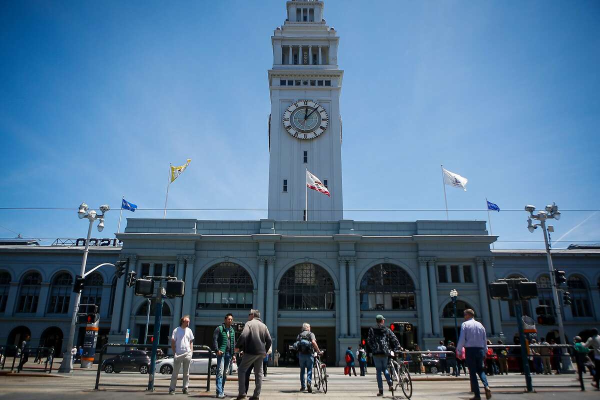 People enter the renovated marketplace in the Ferry Building in San Francisco on June 9, 2017.