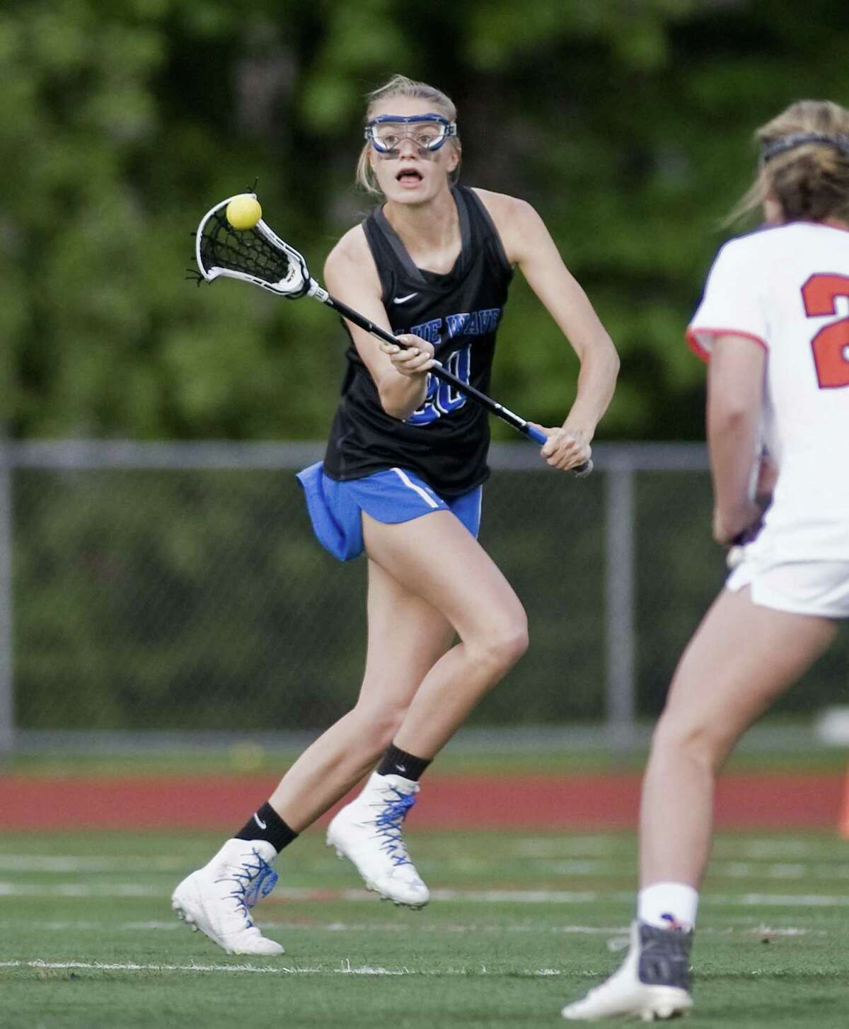 Darien High School's Katie Ramsay receives the ball in the FCIAC girls lacrosse finals against Ridgefield High School, played at Norwalk High School. Wednesday, May 24, 2017