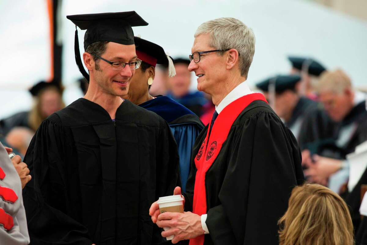 In this image released by Massachusetts Institute of Technology (MIT), Apple CEO Tim Cook (R) participates in commencement ceremonies at MIT on June 9, 2017, in Cambridge, Massachusetts. / AFP PHOTO / Dominick Reuter / RESTRICTED TO EDITORIAL USE - MANDATORY CREDIT "AFP PHOTO / Massachusetts Institute of Technology / Dominick REUTER" - NO MARKETING NO ADVERTISING CAMPAIGNS - DISTRIBUTED AS A SERVICE TO CLIENTS == NO ARCHIVE DOMINICK REUTER/AFP/Getty Images