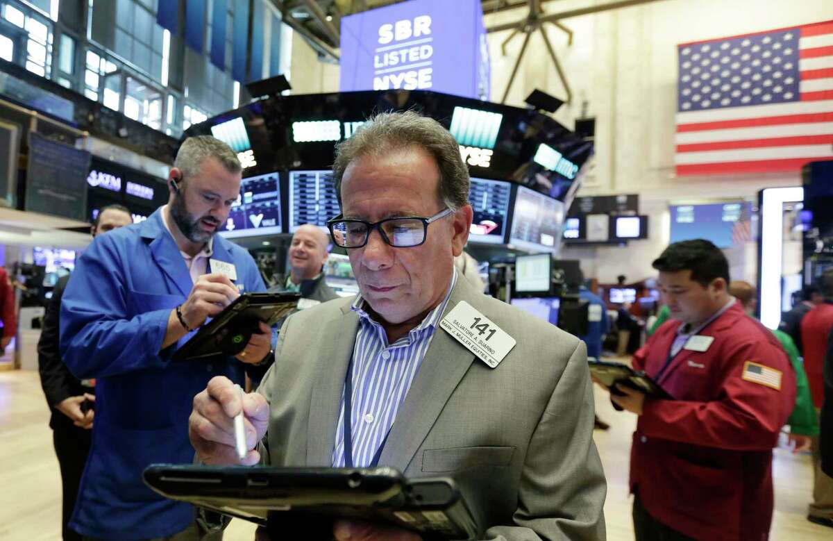 Stock trader Salvatore Suarino works at the New York Stock Exchange, Friday, June 9, 2017. (AP Photo/Richard Drew)