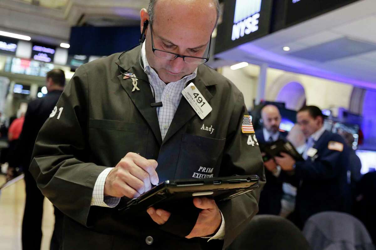 Trader Andrew Silverman works on the floor of the New York Stock Exchange, Friday, June 9, 2017. Banks and energy stocks are leading U.S. indexes higher in early trading on Wall Street. (AP Photo/Richard Drew)