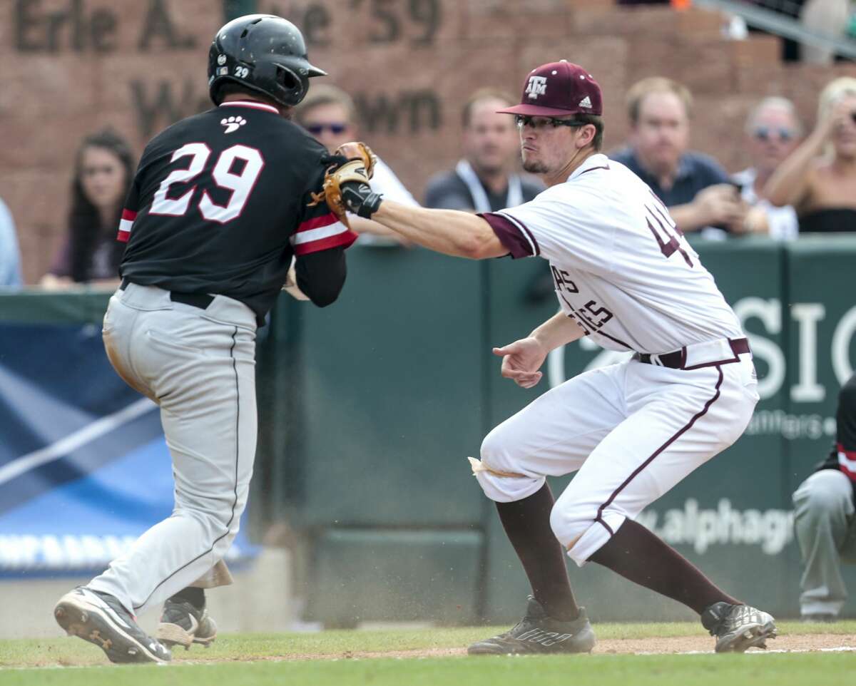 Davidson catcher Jake Sidwell (29) is tagged out by Texas A&M infielder George Janca (44) going back to third on a failed bunt attempt during the 12th inning of an NCAA baseball Super Regional at Olsen Field at Blue Bell Park on Friday, June 9, 2017, in College Station. Texas A&M beat Davidson 7-6 in 15 innings. ( Brett Coomer / Houston Chronicle )