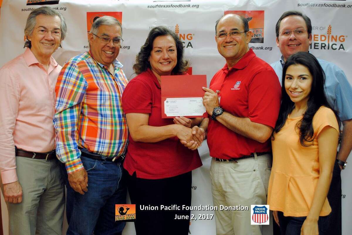 In this photo, the Union Pacific Foundation presents a check donation to the South Texas Food Bank executive director and board members.