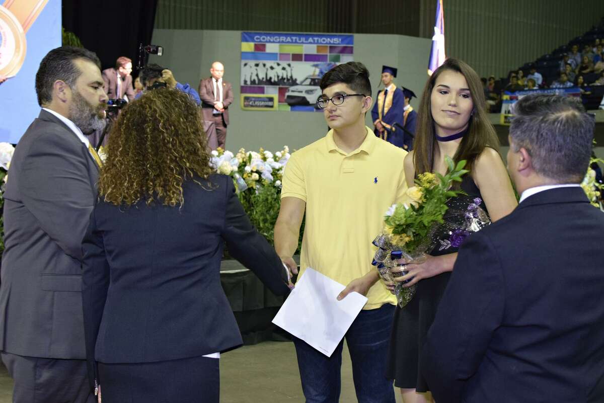 Marko Ynchausti receives his brother's ,Jorge Eduardo Ynchausti, diploma from Alexander High School Administrators during special tribute at the 2017 Alexander Commencement Ceremony to honor the late Jorge Eduardo Ynchausti an Alexander High School student who passed away in a vehicular accident.