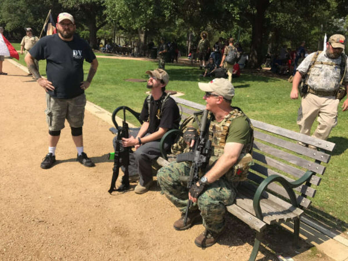 A number of protesters, many armed with guns and wearing camouflage or makeshift armor, rallied at Hermann Park in Houston on Saturday, June 10, 2017