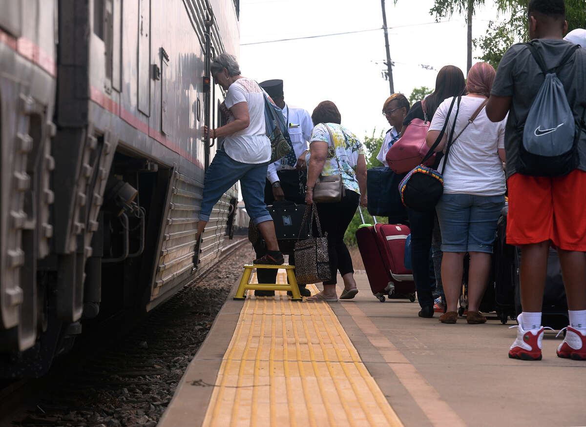 Headed for New Orleans, travelers board an Amtrak train at the Beaumont train station on Friday. Proposed budget cuts from President Trump could effect Amtrak routes. Photo taken Friday, June 09, 2017 Guiseppe Barranco/The Enterprise