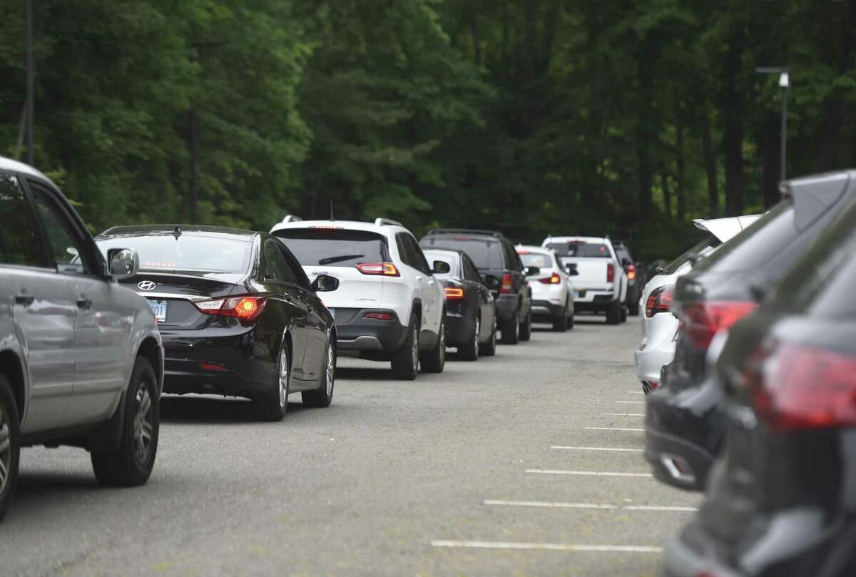 Student cars form a long line waiting to leave the parking lot after dismissal at Greenwich High School in Greenwich, Conn. Thursday, June 8, 2017.