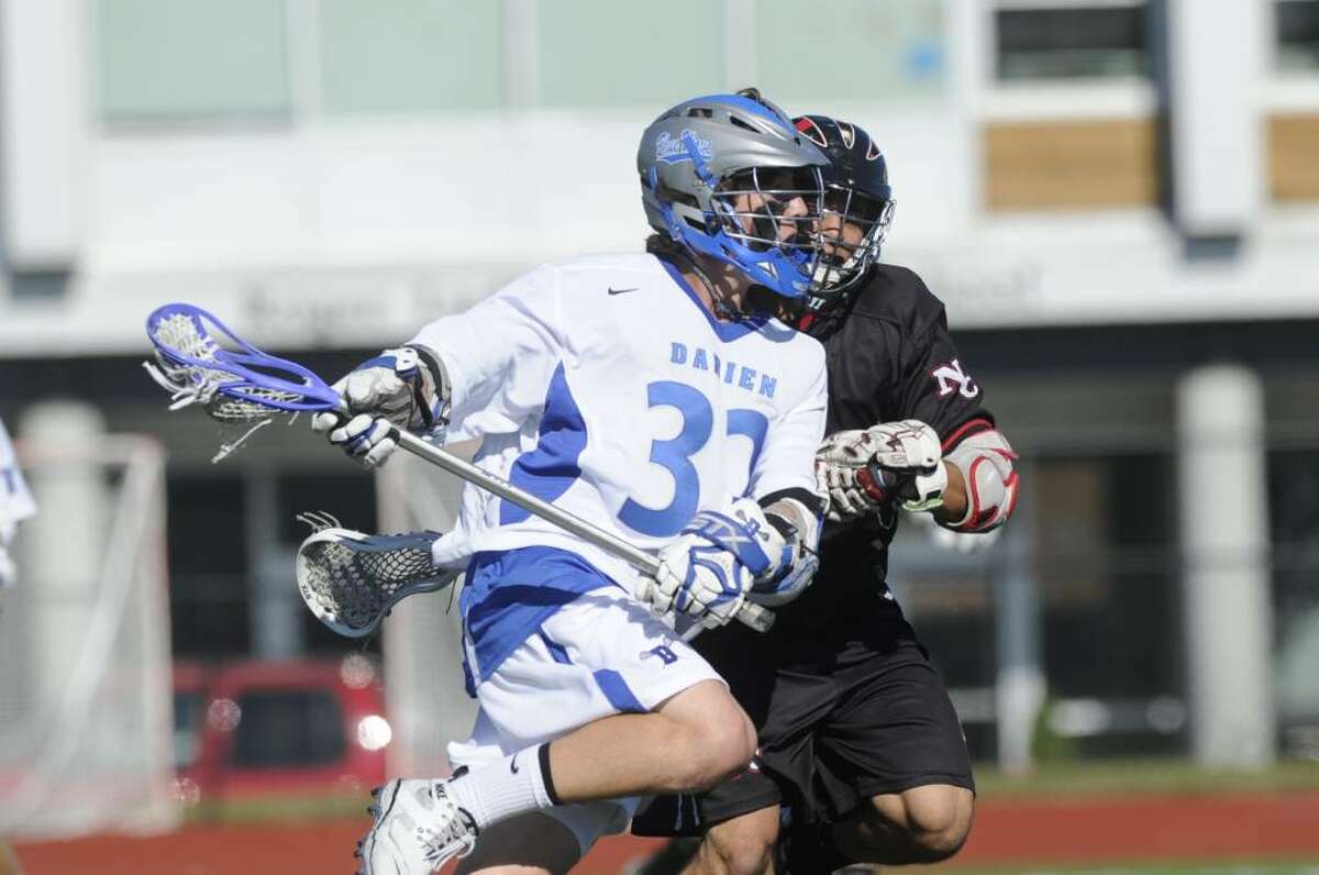 Darien's Henry West in action as Darien High School faces New Canaan High in the Class M State Semifinals at Roger Ludlowe in Fairfield Tuesday June 8, 2010. Darien won 5-4 in double overtime.