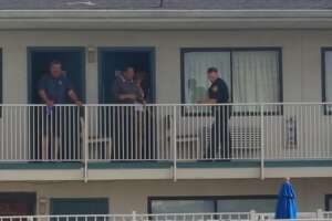 Two masked gunmen shot a man and woman at a Northeast San Antonio motel Saturday