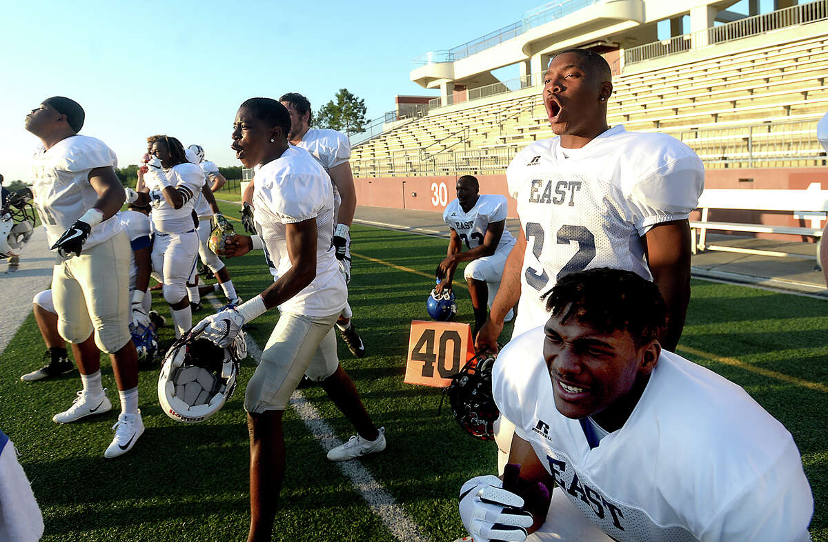 Members of the East team offense celebrate as the defense shuts down West during the All Star football match-up at the Thomas Center Saturday night. Photo taken Saturday, June 10, 2017 Kim Brent/The Enterprise