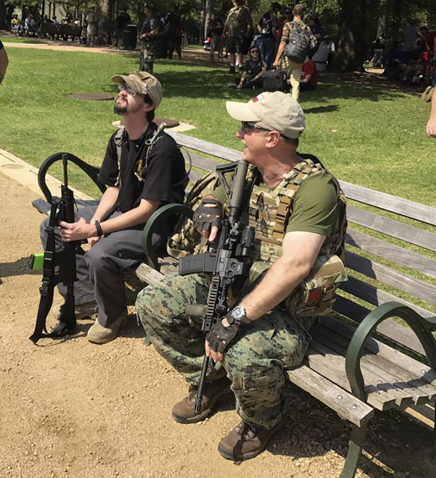 Protesters, some armed, rally to defend Sam Houston