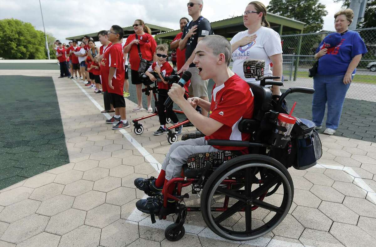 Antonio Zapata, 15, sings the National Anthem before his team's baseball game at the Miracle League of San Antonio on Saturday, June 10, 2017. The Miracle League of San Antonio - started by local attorney Mike Miller - gives special needs kids an opportunity to play the game of baseball in a supportive and fun environment. Six teams concluded their Spring season with each child getting a swing at bat with family and friends cheering them on. At the end, the children received trophies for their participation. (Kin Man Hui/San Antonio Express-News)