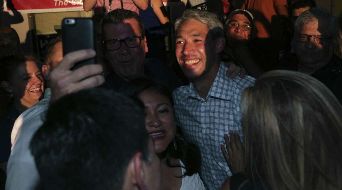 San Antonio mayoral candidate Ron Nirenberg poses for pictures after declaring victory at his campaign headquarters June 10. His close second in the first election meant that the incumbent, Ivy Taylor, knew she was in trouble in a runoff.