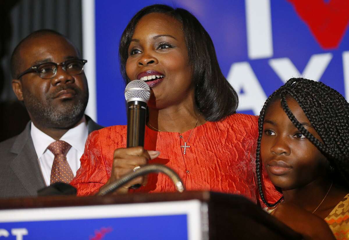 Mayor Ivy Taylor (center) with her husband Rodney Taylor and their daughter Morgan Taylor addresses supporters, at Sunset Station, and concedes the June 10, 2017 runoff election to District 8 Councilman Ron Nirenberg.