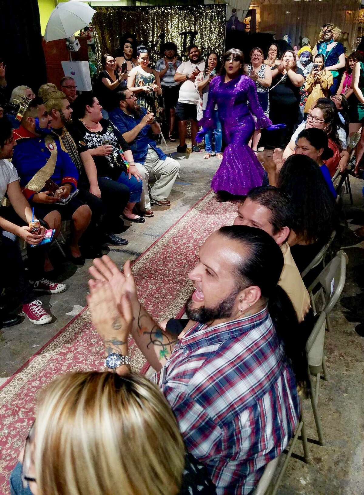 Anthony Diaz, who goes by the stage name of Violetta Slay, lip syncs to a disco melody from Selena as the crowd watches on at the second-installment of MexiQueens, a drag show featuring Latino performers, on May 20, 2017.