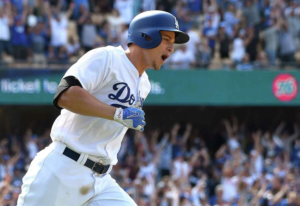 Los Angeles Dodgers' Corey Seager rounds the bases on his three