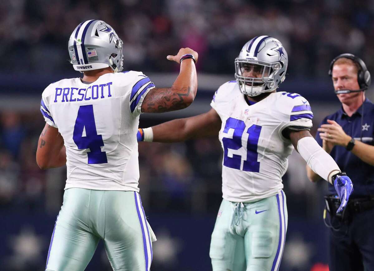 ARLINGTON, TX - DECEMBER 18: Dak Prescott #4 and Ezekiel Elliott of the Dallas Cowboys celebrate after scoring a touchdown during the second quarter against the Tampa Bay Buccaneers at AT&T Stadium on December 18, 2016 in Arlington, Texas. (Photo by Tom Pennington/Getty Images)