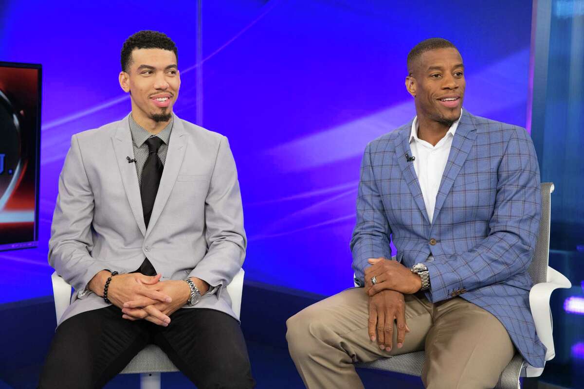 Spurs guard Danny Green (left) and former Spur Antonio Daniels work on their delivery at the National Basketball Players Association?’s 10th annual Sportscaster U. in 2017.