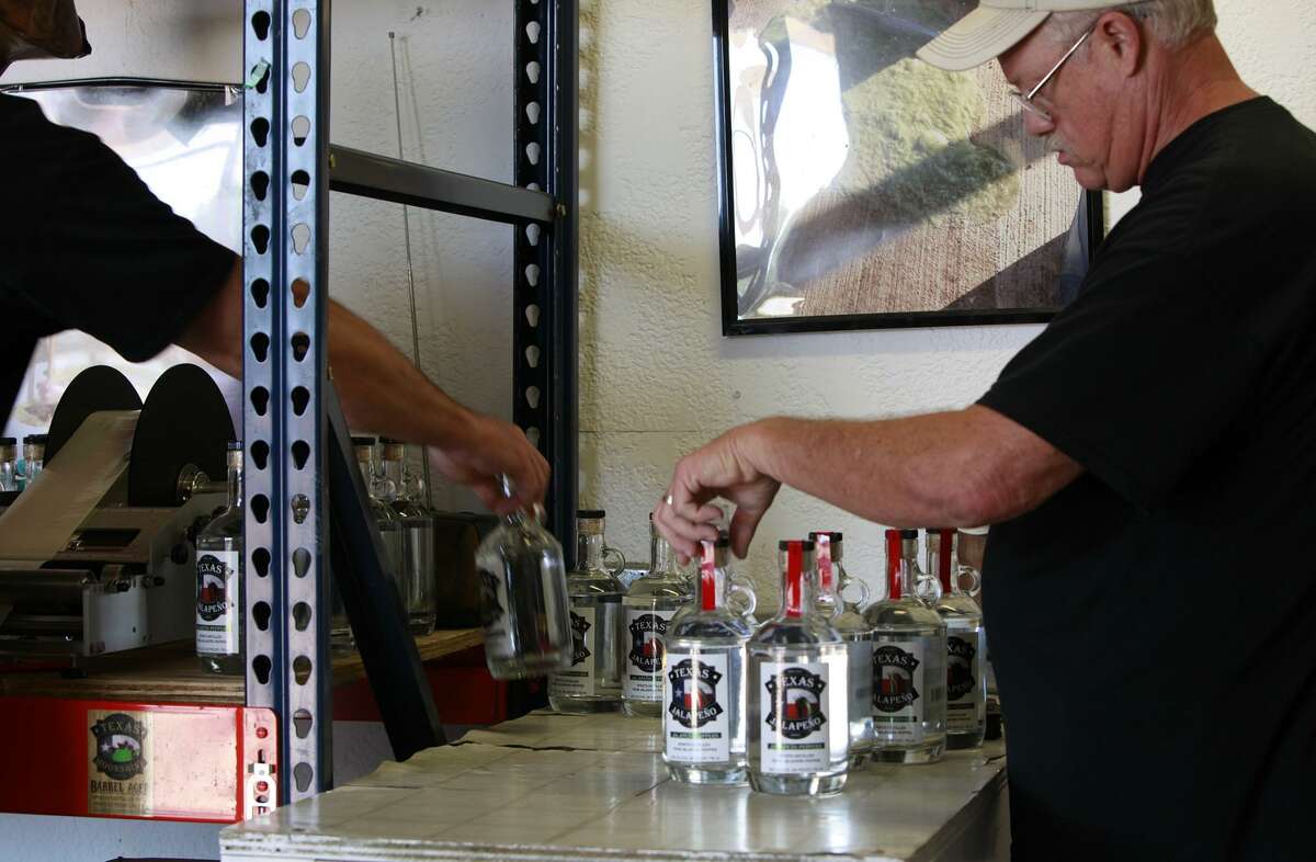 Steve Kite, 61, helps his colleague James Stout who is on the left, by putting the final touches on the finish products. Kite like Stout has been associated with the distillery since its inception. "I was very intrigued and wanted a new challenge in life," he said. Together Kite and Stout bottle nearly 600 specialty spirits in a day.