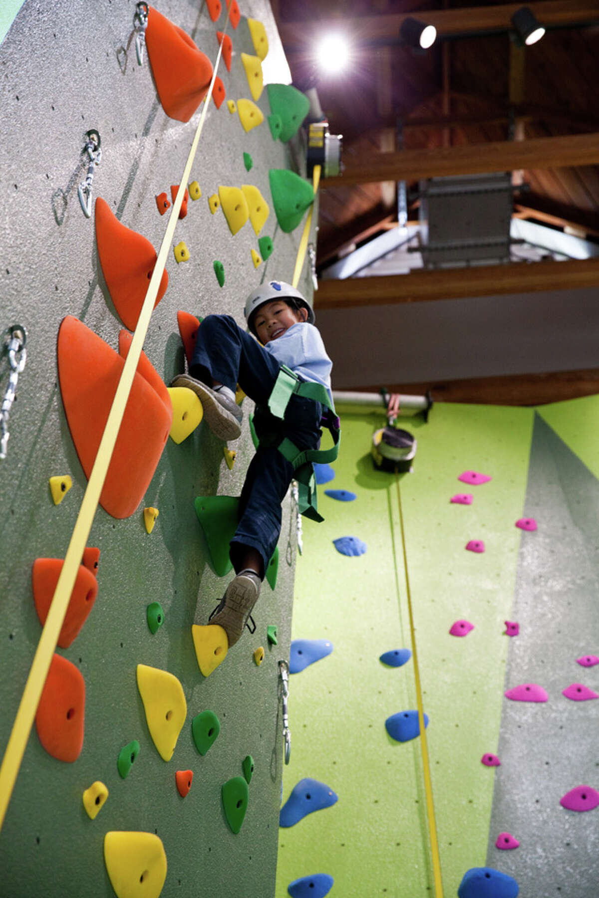Visitors enjoy the new indoor rock climbing walls at the Glen Park Recreation Center in San Francisco's Glen Canyon Park. 