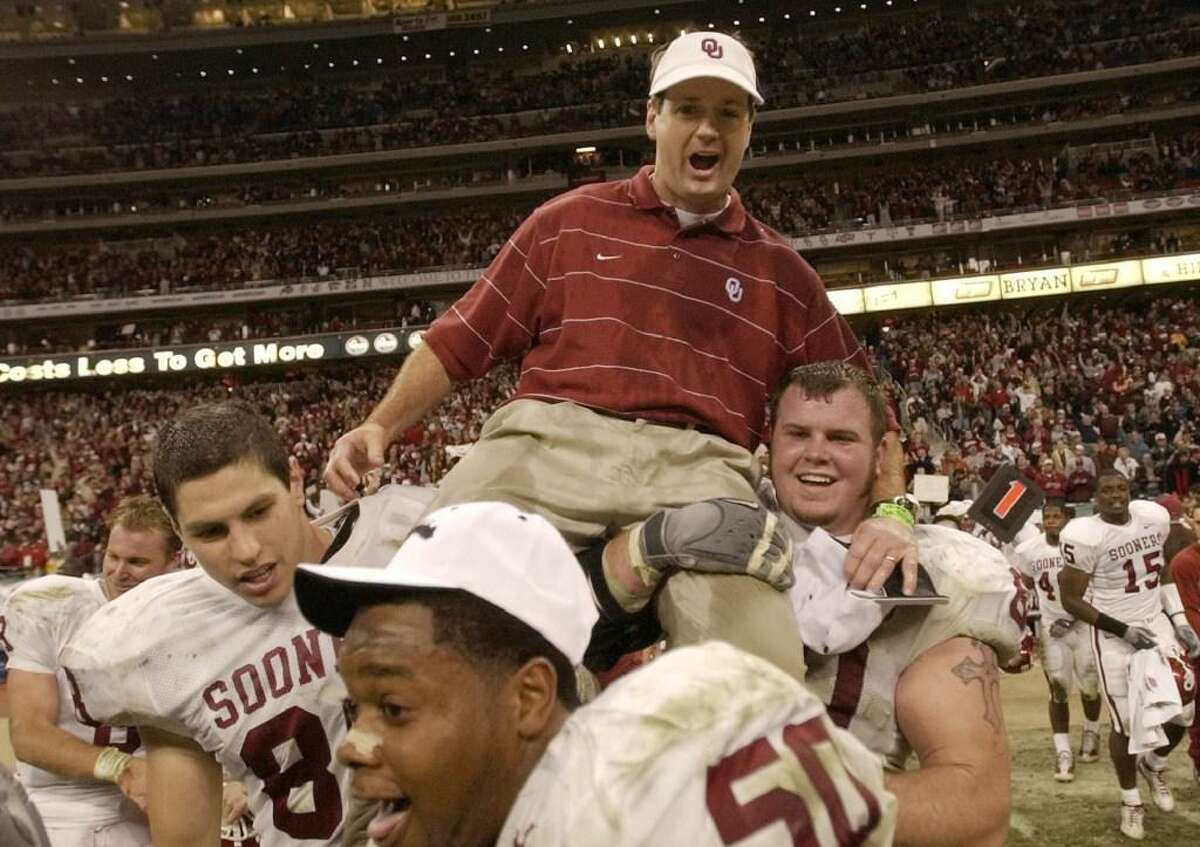 In this Dec. 7, 2002, file photo, Oklahoma players carry off coach Bob Stoops after winning the Big 12 championship with a 29-7 win over Colorado, in Houston. Stoops has decided to retire as Oklahoma’s football coach after 18 seasons that included the 2000 national championship and 10 Big 12 Conference titles.